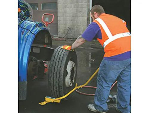 Rock Solid Heavy Duty Truck Wheel Dolly With 9 5 Inch Rollers Made For Low Profile Tires used for tire replacement on a truck.
