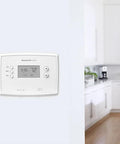 Programmable Thermostat With One Week Programming And Digital Display White in a modern kitchen setting on a wall