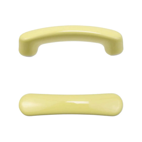 Top view of two glossy yellow ceramic cabinet pulls, featuring a slick high gloss finish, 95 mm long, ideal for kitchens.