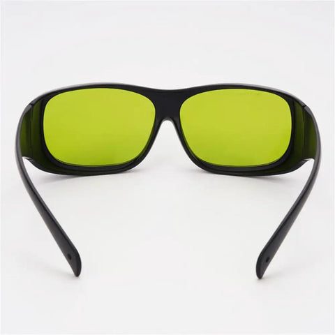 Big Deal Ipl Laser Safety Glasses With Od7 Plus Lens For Spa Owners And Laser Pros Offering Killer Eye Shielding From Eight Hundred To One Thousand One Hundred Nm In Solid Green Rims, front view.