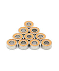Smooth As Butter ABEC 7 Precision 683RS Hybrid Ceramic Steel Ball Bearings 3X7X3MM stacked in a triangle shape.