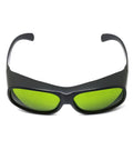 Top Shelf Tough Infrared Laser Safety Glasses Featuring Heavy Duty OD Five Plus And OD Seven Plus Shielding For ND YAG And Diode Lasers Spanning 720 To 1100 Nm Wavelengths Crisp Clear Vision front view of protective eyewear with green lenses.