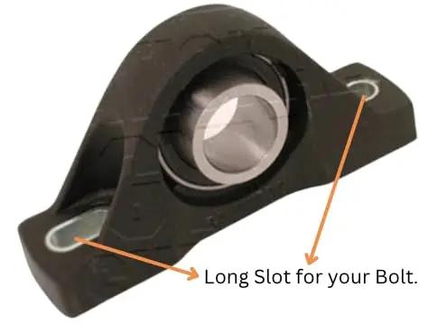 Built Different Pillow Block Bearing With One Inch Inner Bore, showing slotted base for easy mounting on gym rigs.