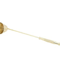 Slick Stainless Steel Candle Snuffer With Ergonomic Long Handle And Hassle Free Wick Control For Tapered Dinner Candles And Fresh Home Decor Setup In Classic Gold Finish shown from side view.