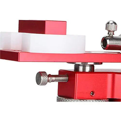Close-up of the Kickass Watch Repair Kit Featuring Rotational Case Opener And Quick Battery Press with red metal components.