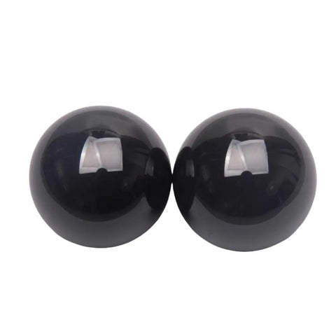 Premium Silicon Nitride Ceramic Ball Bearings Built Tough For Extreme Heat And Heavy Loads At Sixty Three Point Five Millimeters, two black balls.