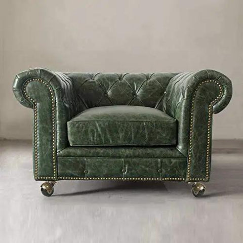 Top Shelf Sweet 2-Inch Brass Ball Casters Set Of 4 Vintage Antique Roller Wheels With 5/16-Inch Stem And Mounting Sockets Swanky Furniture Glide Hardware Upgrade on a green leather chesterfield armchair.