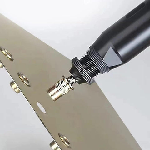 Rivet nut (3/8-16), carbon steel, installed into metal panel with rivet nut tool; close-up