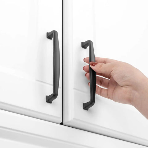 Person using 10 Pack 5 Inch Matte Black Cabinet Pulls And Drawer Handles Heavy Duty Solid Metal Kitchen Hardware.