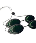Top Shelf Laser Safety Glasses For IPL And Red Light Therapy Featuring Solid Polycarbonate Lenses, green-tinted with strap.
