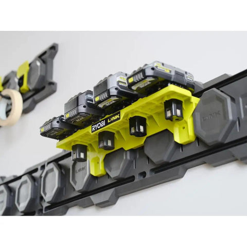 One Plus Tool Holder Modular Storage System for Single Hand Tools with drills and impacts on rotating stem mounted on wall