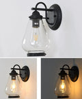 Sharp Badass Hella Waterproof Outdoor Wall Lantern With Slick Clear Glass Shade And Tough Diecast Aluminum Build For Front Porch Or Backyard Vibes Fits E27 Right Now Tonight mounted on a wall, illuminated with warm light.