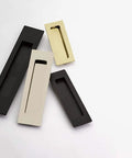Modern Rectangular Flush Pull Handle In Flat Black Finish One And Three Quarters Inches Wide By Six Inches Long Sleek Minimalist Cabinet And Drawer Pull For Contemporary Kitchens And Bathrooms Durable Hardware With Hidden Mounting close-up view among other finishes