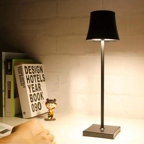 Rechargeable Cordless LED Table Lamp With 5200mAh Battery, All Aluminum Body, on desk with books and figurine
