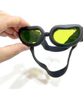 Top Shelf Laser Protection Goggles For Tiny Paws And Furbabies Featuring Anti Glare Uv400 Glass And Rust Proof Frames held in hand.