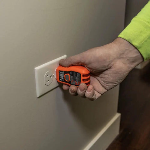 Person using AC Circuit Breaker Kit With GFCI Digital Circuit Breaker Finder Non Contact Voltage Tester Pen Zipper Bag 3 Piece Set For Quick Panel Checks Live Wire Alerts And Safe Home Electrical Troubleshooting to test an electrical outlet.