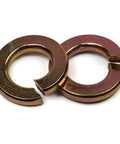 Top Tier Split Ring Lock Washers Crafted From Heavy Duty Grade 8 Steel To Keep Nuts And Bolts Locked Down Cold Without An Inch Of Wiggle Room Rock Solid Anti Vibration Hardware Bulk Pack Zero Play Guaranteed, two washers side by side.