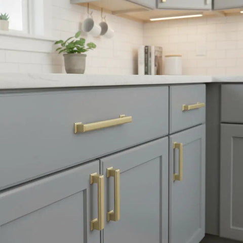 Give Your Home a Chic Glow Up with These Epic Brushed Gold Cabinet Pulls Hardware 10 Pack 5 Inch Handles for Kitchen Cabinets Drawers and Wardrobes Solid Metal Fit on grey kitchen cabinetry.