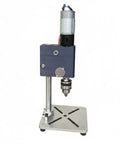 Compact Mini Desktop Drill Press For Home Workshop with sturdy base and motor for precise boring tasks in small garage.