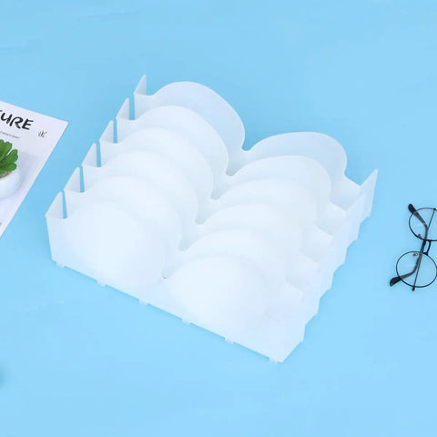 Six Piece Clear Plastic Bra Storage Box With Dividers For Wardrobe Closet Drawer Organization To Keep Lingerie Lineup Hella Neat And Shielded From Deformation A Straight Up Must Have Staple on a blue background.