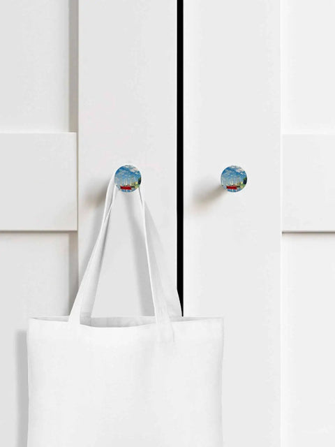 Sweet 1.4 Inch Solid Beechwood Cabinet Knobs And Top Shelf Wooden Drawer Pulls Featuring A Knockout Coastal Sky Design on white cabinet with tote bag.