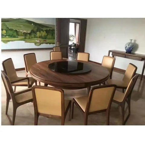 Heavy Duty Tempered Glass Lazy Susan Roller Tray Matte Black 31 Inch Round Dining Table Spinner on wooden table with chairs.