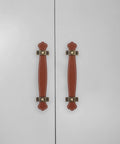 Vintage Leather Trunk Handle Replacement For Cabinets And Drawers Brown Leather Cabinet Pulls shown on white cabinet doors