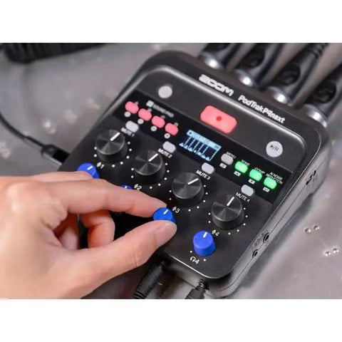 The Ultimate Two Host Podcast Stack Featuring Multitrack Recorder And Dynamic Mics Paired With Headphones, close-up of P4 recorder controls.