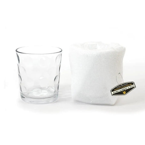 Rock Solid 70 Pack Of 16 By 12 Inch Foam Cushion Wrap Sheets For Moving And Shipping Supplies With Reusable Polyethylene Padding To Shield Your Breakables On The Road In White next to a clear glass.