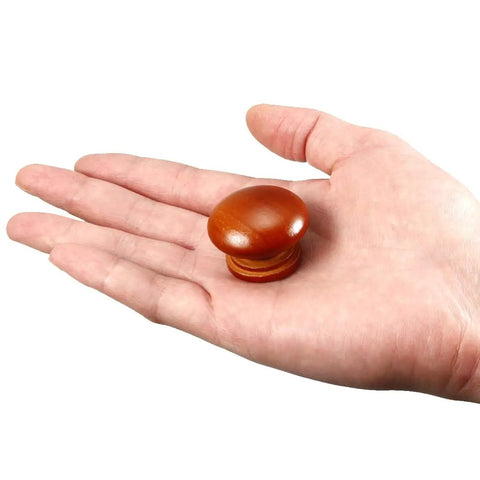 Revamp Your Space With These Awesome 35mm Round Wood Drawer Knobs In A Cool Dark Red Shade. 35mm round dark red wood knob in hand.
