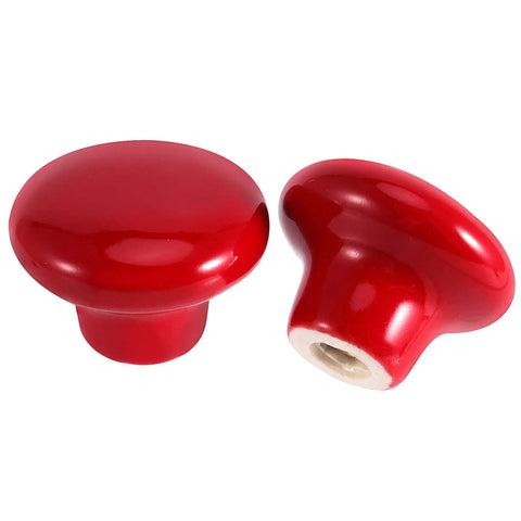 Two vibrant red ceramic cabinet knobs, round shape, 1.26 inches size, for vintage dressers or kitchen cabinets.