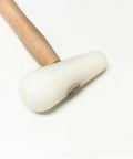 Premium Domed Nylon Hammer Featuring A Rock Solid Five Inch Head And Eight Ounce Weight For Metalsmith Forming Dapping And Custom Metalworking Tools. Close-up of nylon head and hardwood shaft.