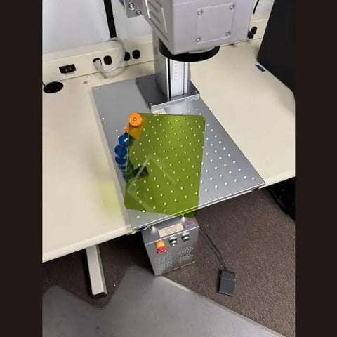 Kickass Articulated Fiber Laser Engraver Safety Window Shield Featuring 180mm Polymer Lens Protector mounted above a workbench.
