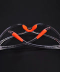 Four Pack Real Deal Fogless Safety Glasses With Thick Padding And Rounded Edges Windproof Splash Goggles designed with bright orange accents.