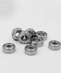 Heavy Duty Sealed Ceramic Ball Bearings For Electric Bikes And Skateboard Trucks High Precision Zirconia Rollers in silver and black colors.