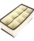 Top Tier Setup For Messy Drawers This Foldable Beige Drawer Organizer with eight compartments in soft non-woven fabric.