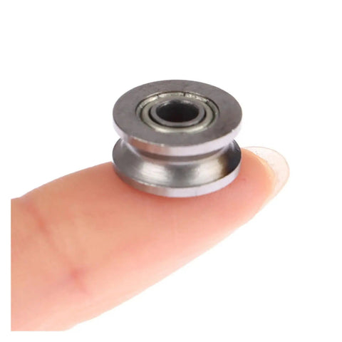 10 Pack V624ZZ V Groove Sealed Ball Bearings 4X13X6MM held on a finger, showcasing smooth metal design for linear guide applications.
