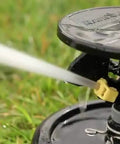 2045A Maxi-Paw Sprinkler Bundle With All 7 Nozzles Included Heavy-Duty Impact Drive spraying water on grass
