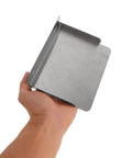 Heavy Stainless Steel Electric Vehicle Charging Station Cover With Complete Weather Blocking Shield and Tough As Nails Build Quality for Driveway or Garage Storage, held in hand.