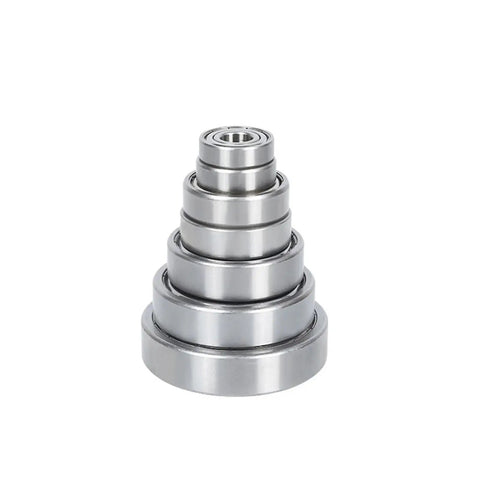Rock Solid Stainless Steel Miniature Deep Groove Ball Bearing Delivers High Precision Run And Hella Smooth Low Friction Performance With Quiet Operation stacked in a conical arrangement.