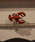 Premium Red Lobster Metal Drawer Pulls Featuring A Slick Distressed Finish For Nautical Cabinet Hardware and Coastal Kitchen Decor on a white background.