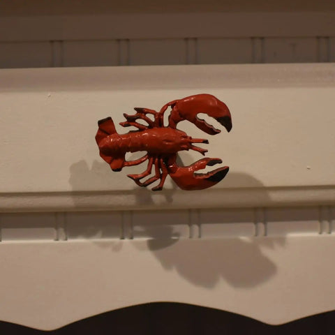 Premium Red Lobster Metal Drawer Pulls Featuring A Slick Distressed Finish For Nautical Cabinet Hardware and Coastal Kitchen Decor on a white background.