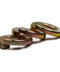 Top Tier Split Ring Lock Washers Crafted From Heavy Duty Grade 8 Steel To Keep Nuts And Bolts Locked Down Cold Without An Inch Of Wiggle Room Rock Solid Anti Vibration Hardware Bulk Pack showing three washers.