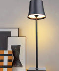 Rechargeable Cordless LED Table Lamp With 5200mAh Battery, All Aluminum Body, IP54 Waterproof, on table with artwork