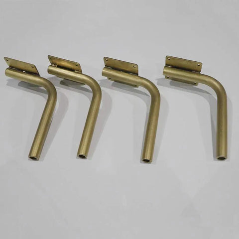Step Up Your Space Game With Beefy Stainless Steel L Shaped Table Legs, Gold Brushed Heavy Duty Sofa Risers, Rust Resistant Lift Foot Accessories, Tough Support For Tv Stand, Pack Of 4 - four gold brushed steel L-shaped table legs.