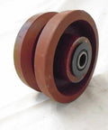 Bulletproof Four Inch Two Inch V Groove Caster Wheel With Seven Eighths Stem Crafted From Rugged Ductile Steel And Rollin Smooth On Heavy Duty Bearings For A Rock Solid One Five Zero Zero Pound Load Rating In Classic Burgundy, showing side view of wheel and bearing.