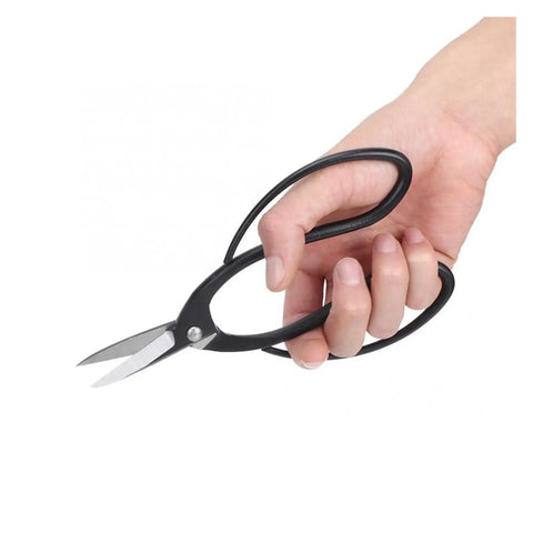 Rust Proof Steel Bonsai Pruning Tools 6 Piece Garden Snips And Clippers With Durable Travel Bag Easy Grip Blades in hand for trimming.