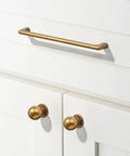 15 Pack 3 Inch Antique Brass Cup Pulls For Kitchen Drawers Solid Zinc Alloy Vintage Retro Hardware on white cabinets.