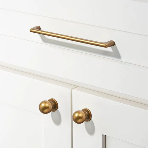 15 Pack 3 Inch Antique Brass Cup Pulls For Kitchen Drawers Solid Zinc Alloy Vintage Retro Hardware on white cabinets.