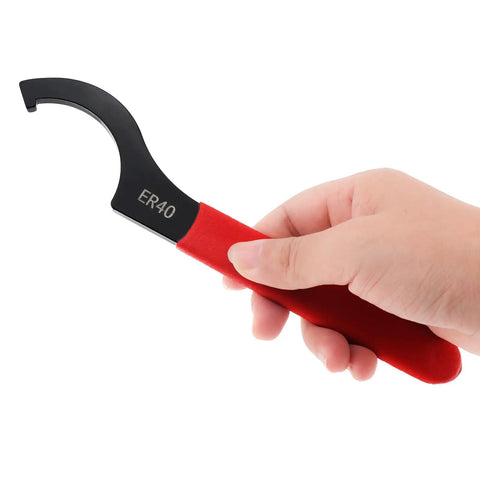 Hand holding ER40 wrench from Pro Grade Coilover Spanner Wrench Set With Roll Up Pouch Includes ER16M ER20A 38 to 42 APU16 ER32 ER40